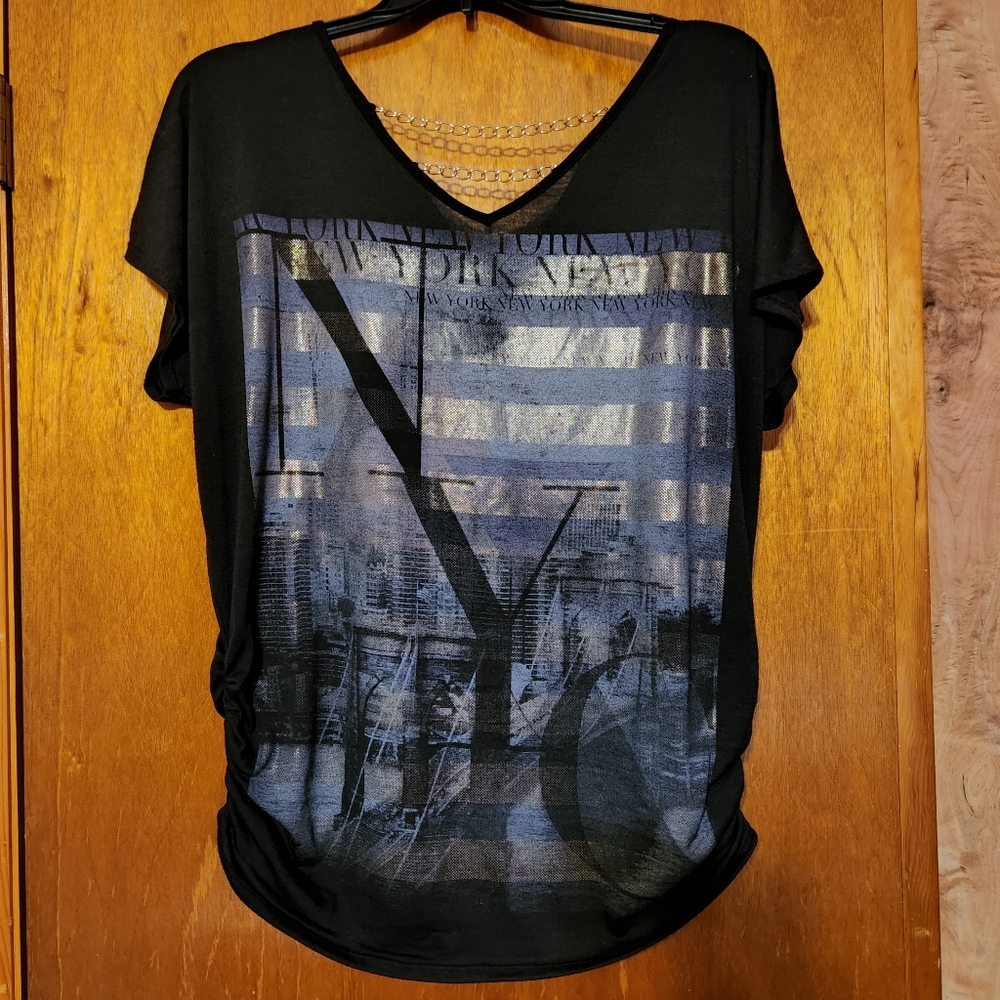 Cute black top with gold chain accent